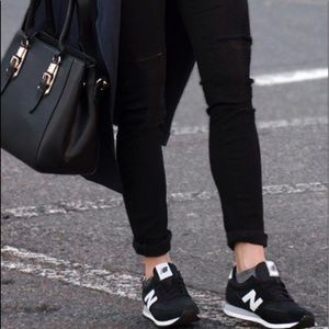 Black and white New Balance 515’s